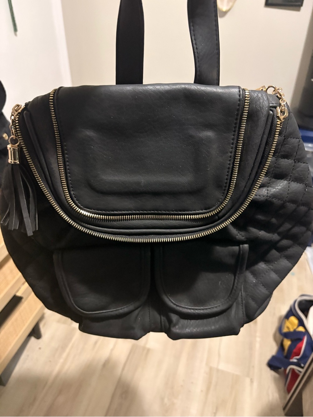 Imoshion Black Quilted Backpack with Gold-Tone Zippers and Tassel